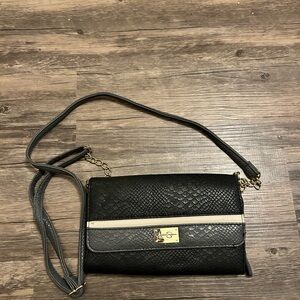 Jessica Simpson Sleek Black Crossbody Bag with Gold Clasp and Textured Finish